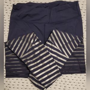 Nike leggings - size medium - grayish blue color with silver stripes around legs